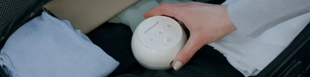 Header Image - Woman packing portable CPAP into Suitcase